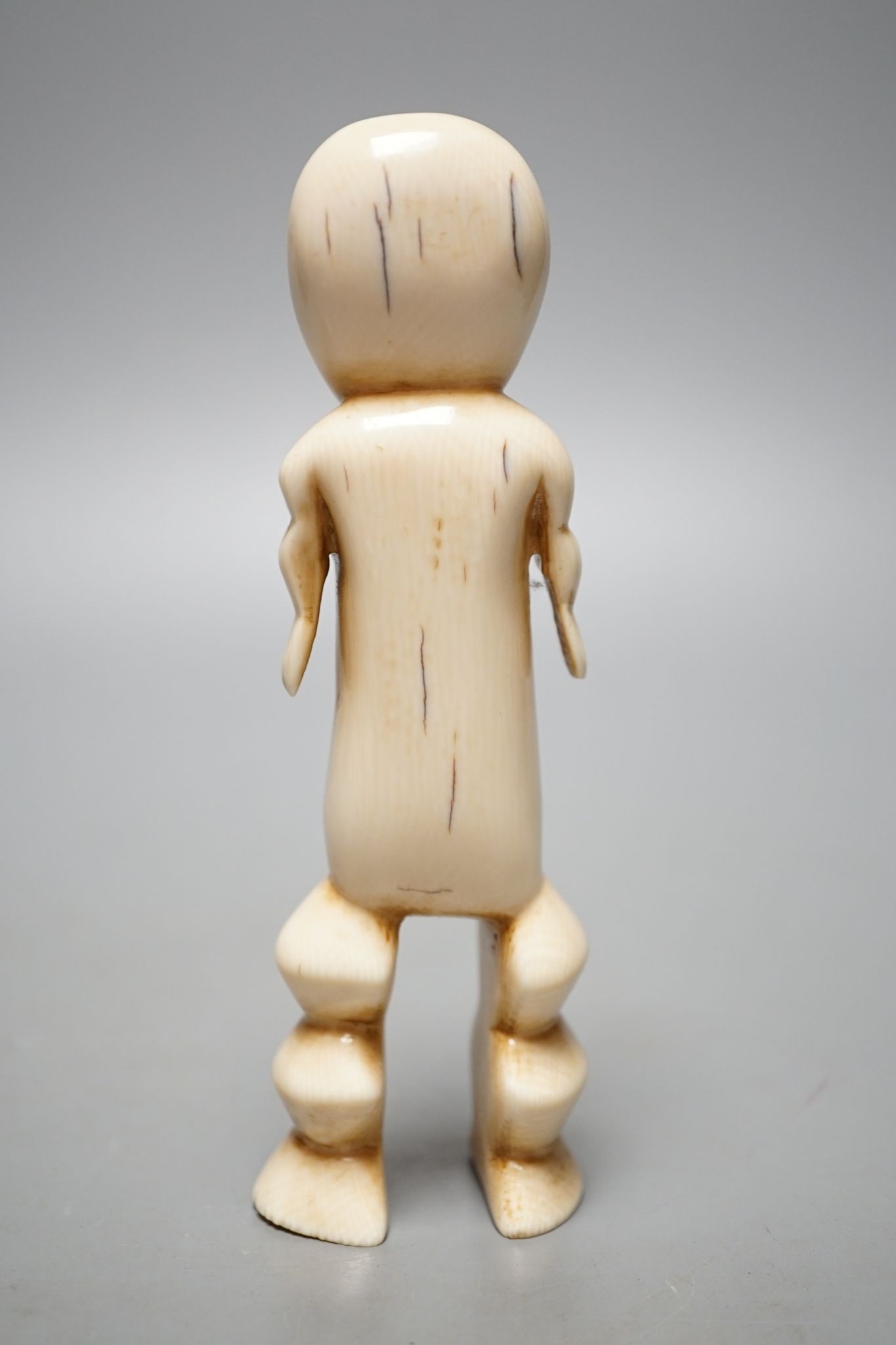A Lega ivory figure, 15 cms high.